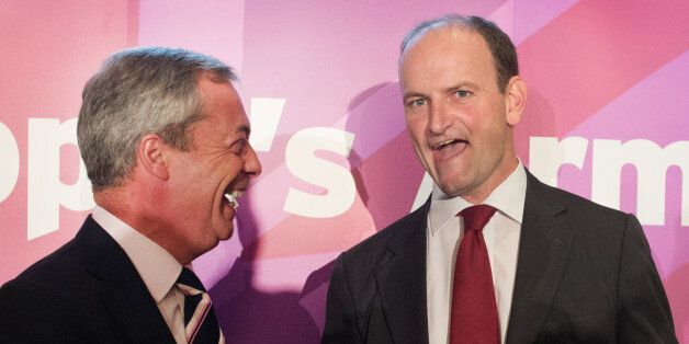 UKIP leader Nigel Farage (left) with Douglas Carswell during a press conference in central London where the Conservative MP defected to his party today.