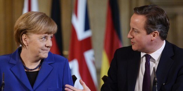 Prime Minister David Cameron with German Chancellor Angela Merkel during a press conference at 10 Downing Street, London.