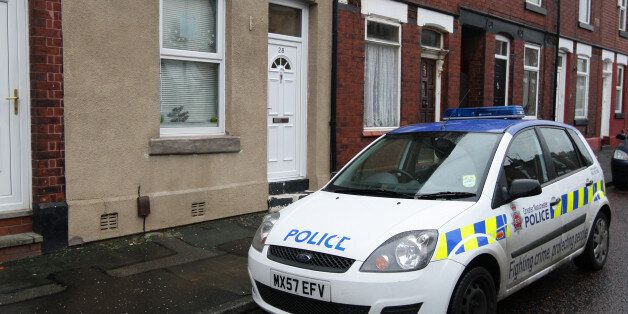 A police car outside the home of Victorino Chua, in Stockport. The 46-year-old male nurse is suspected of murdering three hospital patients at Stepping Hill Hospital in Cheshire and has been released on police bail pending further inquiries.