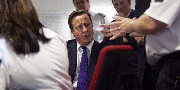 LONDION - OCTOBER 10: Prime Minister David Cameron talks to UK border agency officials in their control room during a visit to Heathrow terminal 5, on October 10, 2011 in London, England. Cameron's visit to the airport comes ahead of his talk on immigration controls. (Photo by Richard Pohle - WPA Pool/Getty Images)