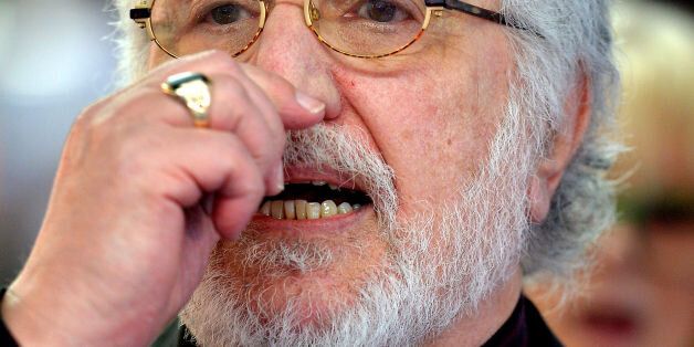 An emotional Dave Lee Travis gives a short address to the waiting media outside Southwark Crown Court, in south London, after being told he will face a re-trial for two sex offences.