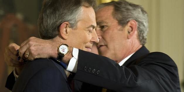 US President George W. Bush (R) awards Former British Prime Minister Tony Blair (L) Presidential Medal of Freedom in the East Room of the White House in Washington, DC, January 13, 2009. AFP PHOTO/Jim WATSON (Photo credit should read JIM WATSON/AFP/Getty Images)