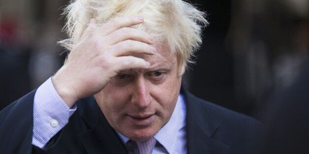 LONDON, ENGLAND - SEPTEMBER 02: Boris Johnson, the Mayor of London, prepares to be interviewed in Leicester Square following his regular 'Ask Boris' phone-in show on LBC talk radio on September 2, 2014 in London, England. Plans for a major new airport to be constructed on an island in the Thames estuary, which have been championed by Mr Johnson and dubbed 'Boris Island', have rejected in a report by the Airports Commission. (Photo by Oli Scarff/Getty Images)