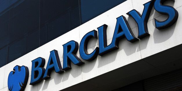 Signage for Barclays Plc is displayed outside a bank branch in Karachi, Pakistan, on Thursday, Aug. 15, 2013. Barclays, the U.K.s second-largest lender by assets, expects its Pakistan unit to post record profit this year as cost cutting measures help it weather interest rates at a seven-year low. Photographer: Asim Hafeez/Bloomberg via Getty Images