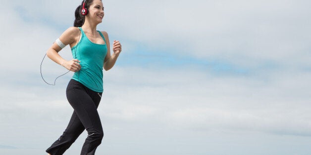 beautiful young woman jogging...