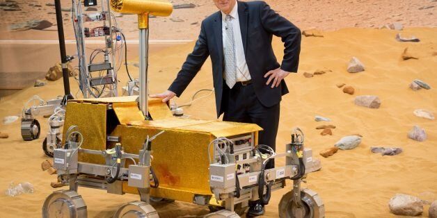 British Business Secretary Vince Cable stands with the 'Bridget' rover on the Mars Yard at Airbus Defence and Space in Stevenage, England on March 27, 2014. The Mars Yard provides a test bed area for prototype 'Rover' vehicles that may be used to provide data from the surface of the planet Mars. AFP PHOTO / LEON NEAL (Photo credit should read LEON NEAL/AFP/Getty Images)
