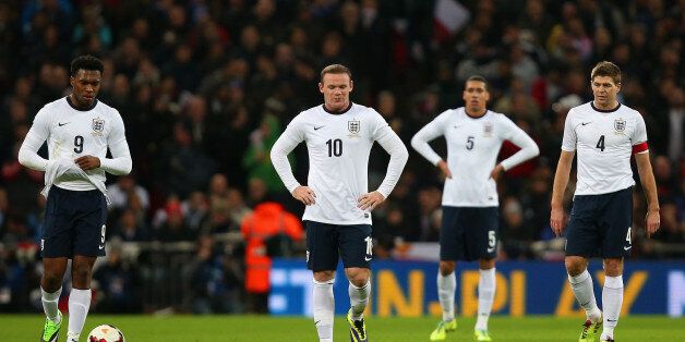 LONDON, ENGLAND - NOVEMBER 19: Daniel Sturridge, Wayne Rooney, Chris Smalling, Steven Gerrard of England of England stand dejected after conceding the first goal during the International Friendly match between England and Germany at Wembley Stadium on November 19, 2013 in London, England. (Photo by Jan Kruger - The FA/The FA via Getty Images)