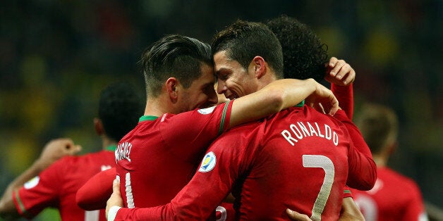 STOCKHOLM, SWEDEN - NOVEMBER 19: Cristiano Ronaldo of Portugal celebrates after scoring their 3rd goal during the FIFA 2014 World Cup Qualifier Play-off Second Leg match between Sweden and Portugal at Friends Arena on November 19, 2013 in Stockholm, Sweden. (Photo by Martin Rose/Getty Images,)