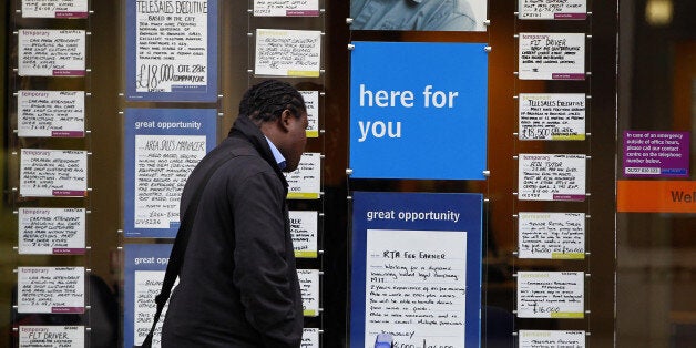 A person looks at job vacancies in a recruitment shop in Liverpool City Centre, as it was announced today that youth unemployment had reached a record high of over a million.