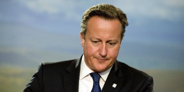 Britain's Prime Minister David Cameron looks on, ahead of a meeting on the second day of the NATO 2014 Summit at the Celtic Manor Resort in Newport, South Wales, on September 5, 2014. NATO leaders are expected to announce a raft of fresh sanctions against Russia on Friday over its actions in Ukraine, although hopes remain that a ceasefire can be forged at peace talks in Minsk on the same day. AFP PHOTO/ALAIN JOCARD/POOL (Photo credit should read ALAIN JOCARD/AFP/Getty Images)