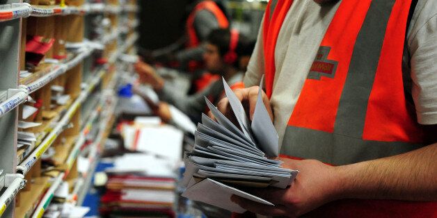 Royal Mail staff sort Christmas post at Nottingham Mail Centre, Beeston, Nottingham, as they work to ensure post arrives in time for December 25. PRESS ASSOCIATION Photo. Picture date: Tuesday December 17, 2013. Photo credit should read: Rui Vieira/PA Wire