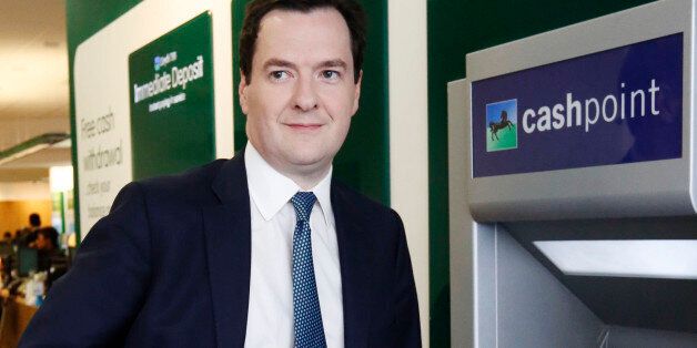Chancellor of the Exchequer George Osborne uses a Lloyds Cashpoint machine to withdraw some money during a visit to a branch of Lloyds TSB on The Strand, in central London.