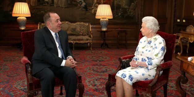 File photo dated 1/7/2014 of Queen Elizabeth II holding an audience with Scotland's First Minister Alex Salmond at the Palace of Holyroodhouse in Edinburgh. The Queen "will be proud" to be the monarch of an independent Scotland, according to Salmond.