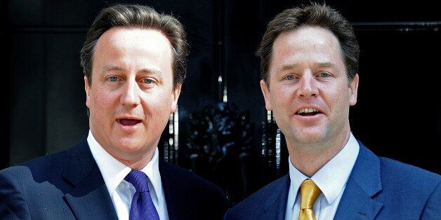 (FILES) This file picture taken on May 12, 2010 shows Britain's Prime Minister David Cameron (L) posing for pictures with Deputy Prime Minister Nick Clegg outside 10 Downing Street in London. A year after their chummy first appearance in Downing Street's rose garden the honeymoon is over for the leaders of Britain's coalition, but this thorny union has surprised many by surviving for so long. Conservative Prime Minister David Cameron and Deputy Prime Minister Nick Clegg of the Liberal Democrats