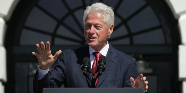 WASHINGTON, DC - SEPTEMBER 12: Former U. S. President Bill Clinton speaks during an AmeriCorps Pledge ceremony on the South Lawn of the White House September 12, 2014 in Washington, DC. Former President Clinton, who established the program and swore in the first class in 1994, joined President Obama to celebrate the 20th anniversary of the national service program. (Photo by Alex Wong/Getty Images)