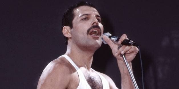 LONDON - JULY 13: Freddie Mercury of Queen performs on stage at Live Aid at Wembley Stadium on 13th July 1985 in London. (Photo by Phil Dent/Redferns)