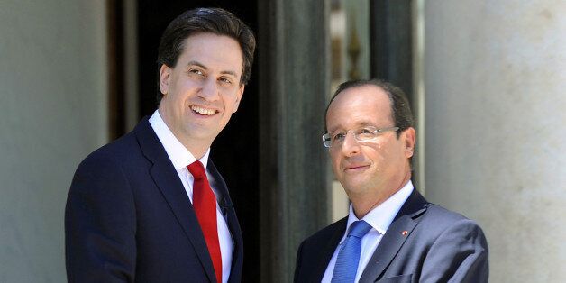 French President Francois Hollande (R) welcomes British Leader of the Labour party Ed Miliband before a meeting at the Elysee Palace in Paris, on July 24, 2012. AFP PHOTO / BERTRAND GUAY (Photo credit should read BERTRAND GUAY/AFP/GettyImages)