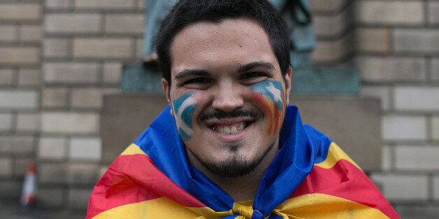 A Catalan man, is seen in the streets of Edinburgh with Catalan flag to support the 'Yes' campaign