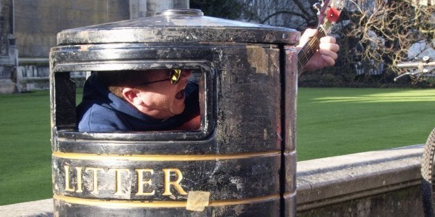 Busker in a bin, Cambridge, UK. (Photo by: Education Images/UIG via Getty Images)