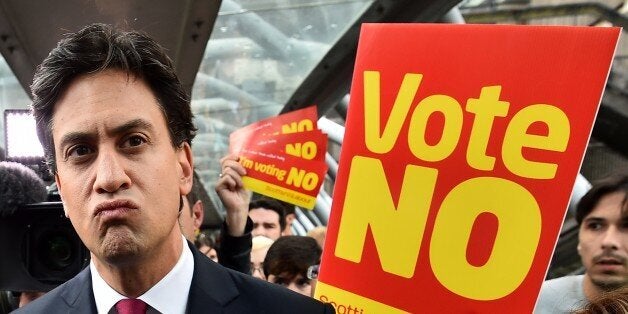 Labour Party leader Ed Miliband addresses the public and the media as he walks in Edinburgh, Scotland, on September 16, 2014, ahead of the referendum on Scotland's independence. The leaders of the three main British parties on Tuesday issued a joint pledge to give the Scottish parliament more powers if voters reject independence, in a final drive to stop the United Kingdom splitting. AFP PHOTO / BEN STANSALL (Photo credit should read BEN STANSALL/AFP/Getty Images)