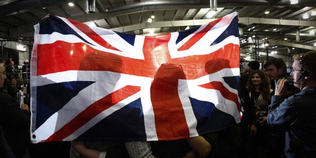 Anti-independence Better Together 'no' campaigners, hold a Union flag as they celebrate the result of Fife local authority's declaration, during the Scottish independence referendum announcements at the Royal Highland Center in Edinburgh, U.K., on Friday, Sept. 19, 2014. Scotland voted to remain in the U.K. after an independence referendum that put the future of the 307-year-old union on a knife edge and risked years of political and financial turmoil. Photographer: Simon Dawson/Bloomberg via Ge