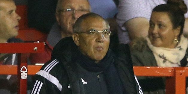 NOTTINGHAM, ENGLAND - SEPTEMBER 17: Felix Magath, (C) the Fulham manager looks on with his management team during the Sky Bet Championship match between Nottingham Forest and Fulham at the City Ground on September 17, 2014 in Nottingham, England. (Photo by David Rogers/Getty Images)