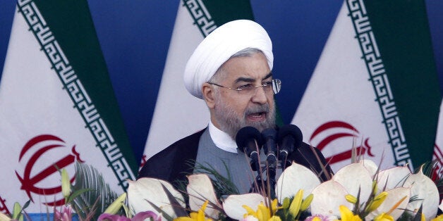 TEHRAN, IRAN - SEPTEMBER 22: Iranian President Hassan Rouhani delivers his speech during the annual military parade in Tehran marking the anniversary of Iran's war with Iraq, on September 22, 2014. (Photo by Fatemeh Bahrami/Anadolu Agency/Getty Images)