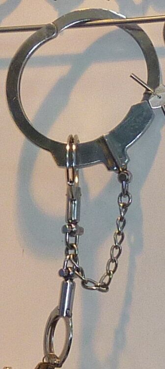 Neck restraint and combination handcuffs