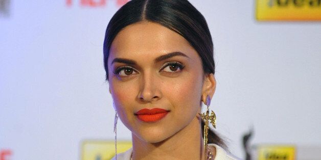 Indian Bollywood actress Deepika Padukone attends the cover launch for the 59th Idea Filmfare Awards Issue in Mumbai on February 14, 2014. AFP PHOTO/STR (Photo credit should read STRDEL/AFP/Getty Images)