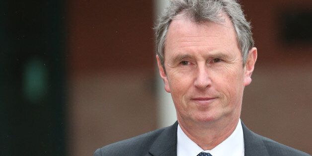 PRESTON, LANCASHIRE - JANUARY 24: Former Deputy Speaker Nigel Evans leaves Preston Crown Court after his pre-trial hearing to face charges of sexual assault on January 24, 2014 in Preston, Lancashire. Mr Evans resigned from his position as the House of Commons deputy speaker last year. The MP for Ribble Valley has been charged with two counts of indecent assault, five of sexual assault, and one of rape against seven alleged male victims. (Photo by Christopher Furlong/Getty Images)