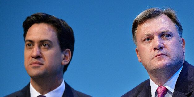 Britain's Labour party leader Ed Miliband (L) and Shadow Chancellor of the Exchequer Ed Balls attend the second day of the Labour party conference in Brighton, Sussex, south England on September 23, 2013. Britain's main opposition Labour party kicked off its annual conference on September 22 with leader Ed Miliband under pressure amid sliding poll ratings 18 months before a general election.AFP PHOTO / BEN STANSALL (Photo credit should read BEN STANSALL/AFP/Getty Images)
