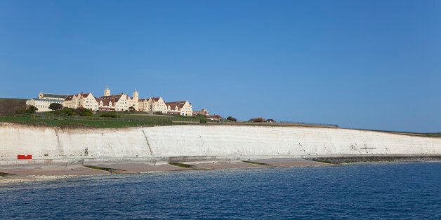 England, East Sussex, Brighton, white cliff coastline with Roedean private school for girls.