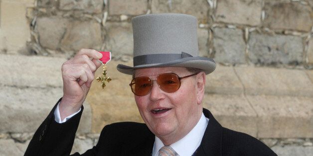 Former racehorse trainer Toby Balding poses with his medal after he was made an Officer of the Order of the British Empire (OBE) by Britain's Queen Elizabeth II during an investiture ceremony at Windsor Castle on April 3, 2012. AFP PHOTO / POOL / STEVE PARSONS (Photo credit should read Steve Parsons/AFP/Getty Images)