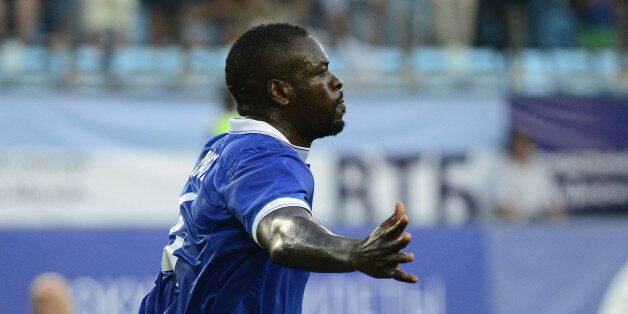 MOSCOW, RUSSIA - AUGUST 21 : Christopher Samba of Dinamo Moscow (R) celebrates after scoring a goal during UEFA Europe League play-off first leg football match between Dinamo Moscow vs Omonia at Arena Khimki Stadium in Moscow, Russia on August 21, 2014. (Photo by Sefa Karacan/Anadolu Agency/Getty Images)