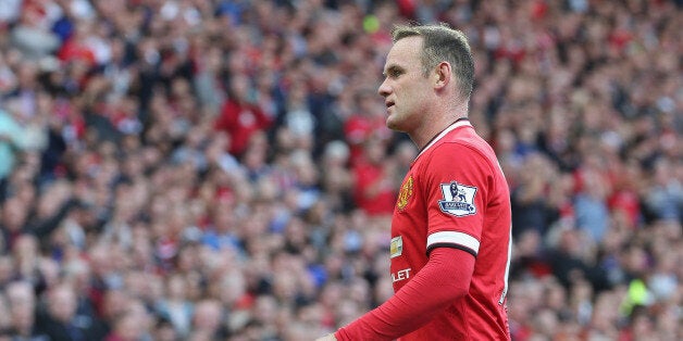 MANCHESTER, ENGLAND - SEPTEMBER 27: Wayne Rooney of Manchester United walks off after being sent off during the Barclays Premier League match between Manchester United and West Ham United at Old Trafford on September 27, 2014 in Manchester, England. (Photo by John Peters/Man Utd via Getty Images)