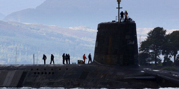 FASLANE, SCOTLAND - SEPTEMBER 23: A trident submarine makes it's way out from Faslane Naval base on September 23, 2009 in Faslane, Scotland. British prime minister Gordon Brown, will tell the UN the he will cut the trident missile carrying submarine from four to three. (Photo by Jeff J Mitchell/Getty Images)