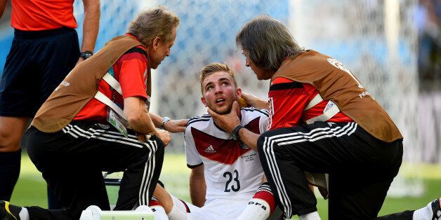 RIO DE JANEIRO, BRAZIL - JULY 13: Christoph Kramer of Germany receives a medical treatment during the 2014 FIFA World Cup Brazil Final match between Germany and Argentina at Maracana on July 13, 2014 in Rio de Janeiro, Brazil. (Photo by Shaun Botterill - FIFA/FIFA via Getty Images)