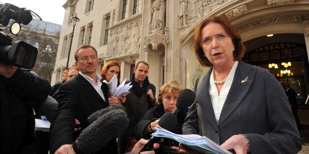 Angela Knight the Chief Executive of the British Bankers Association reads a statement outside the Supreme Court in Westminster central London, after High Street banks won their appeal over unauthorised overdraft charges.