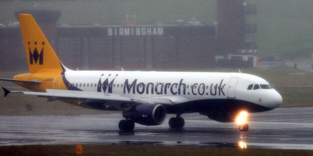 A Monarch Airways plane lands at a wet Birmingham Airport today as the aircraft maintenance division of the travel group has announced plans to build a new facility at Birmingham Airport, creating up to 300 jobs.