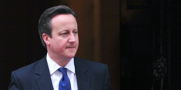 British Prime Minister David Cameron (L) prepares to welcome Irish President Michael Higgins at Downing Street in central London on April 9, 2014. Higgins arrived in London on April 8 in the first state visit by a president of the republic since it gained independence from neighbouring Britain. AFP PHOTO / CARL COURT (Photo credit should read CARL COURT/AFP/Getty Images)