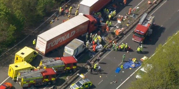 The scene between junction 23 and 22 of the M62 near Huddersfield, today (Friday) following a crash in the early hours of this morning in which one person was killed and several were injured when a lorry travelling west crossed to the eastbound carriageway.Photo by John Giles/PA*EDI*. See PA Story ACCIDENT Motorway