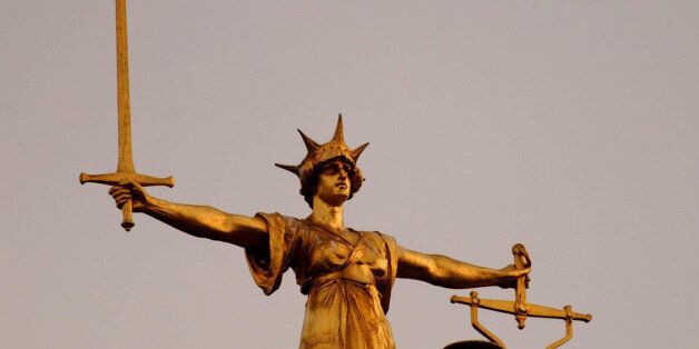 The Scales of Justice on top of the Old Bailey in central London, as the jury in the Soham murder case enters the third night of deliberation. Lord Justice Moses has sent the jury to reach verdict in the case agianst Ian Huntley and Maxine Carr, who face charges relating to the unlawful deaths of school girls Holly Wells and Jessica Chapman.