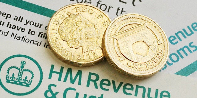 General view of pound coins on HM Revenue & Customs forms before the first budget after the UK lost its prized AAA rating following the recent Moody's downgrade while the economy is on the brink of an unprecedented triple-dip recession after contracting by 0.3\% at the end of 2012 putting the Chancellor under significant pressure.