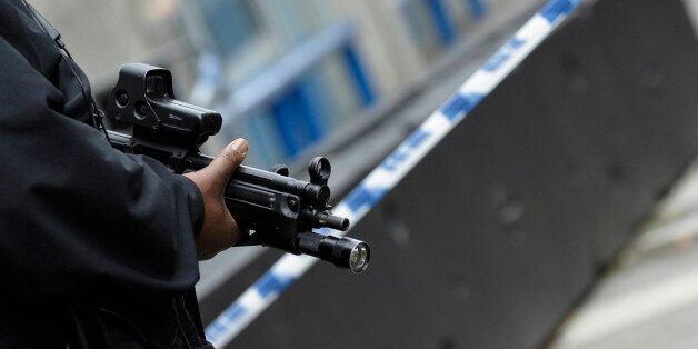 Armed police patrol streets around New Scotland Yard after terrorist bombings London 7 July 2005 UK. (Photo by Photofusion/Universal Images Group via Getty Images)