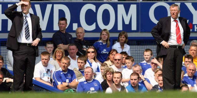 Liverpool, UNITED KINGDOM: David Moyes, manager of Everton (L) and Manchester United manager Sir Alex Ferguson watch their teams during their English Premiership football match at Goodison Park, Liverpool, north west England, 28 April 2007. AFP PHOTO/PAUL ELLIS - Mobile and website uses of domestic English football pictures subject to subscription of a licence with Football Association Premier League (FAPL) tel: +44 207 298 1656. For newspapers where the football content of the printed and elect