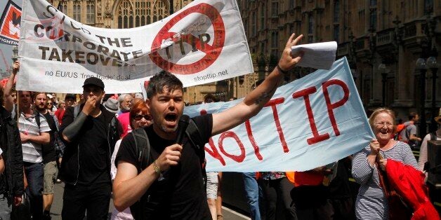 12/07/2014 - Protestors against the EU-US trade deal (TTIP - Transatlantic Trade and Investment Partnership) outside the Houses of Parliament march to Europe House, the London Headquarters of the European Commission and the European Parliament, in Smith Square, London.