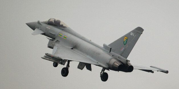 RUISLIP, ENGLAND - MAY 02: An Royal Air Force Typhoon jet, which will be used to defend the skies over the Olympic Games, lands at the RAF Northolt airbase on May 2, 2012 in London, England. The Typhoon jets will take part in operation Exercise Olympic Guardian, an eight-day training exercise over London and the Home Counties to help ensure an incident-free Games. (Photo by Oli Scarff/Getty Images)