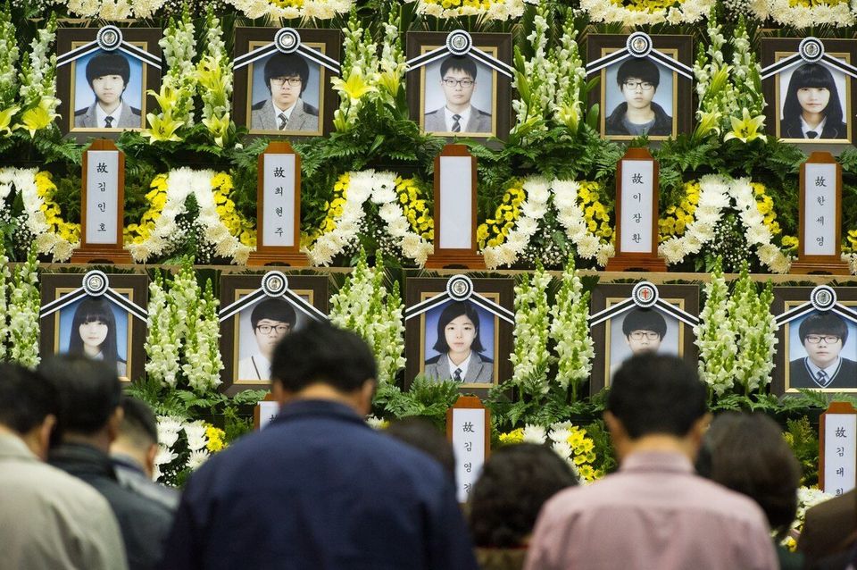 People attend a memorial for the victims of the sunken South Korean ferry 'Sewol'