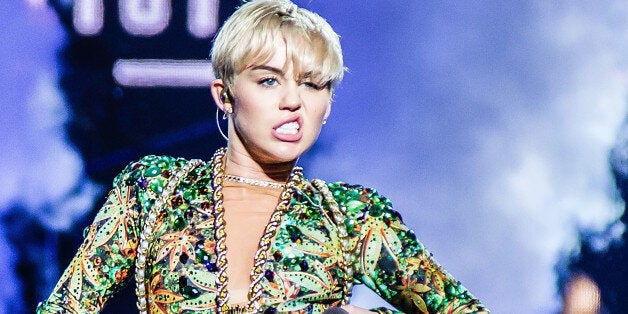 COLUMBUS, OH - APRIL 13: Miley Cyrus performs at Jerome Schottenstein Center on April 13, 2014 in Columbus, Ohio. (Photo by Patrick R. Murphy/Getty Images)