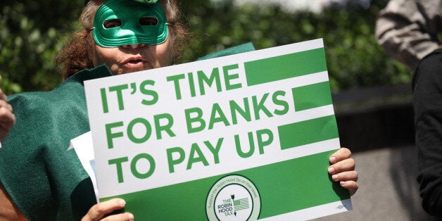 NEW YORK, NY - JUNE 19: The U.S. Robin Hood Tax Campaign protest outside JPMorgan Chase Corporate Headquarters on June 19, 2012 in New York City. (Photo by Neilson Barnard/Getty Images for Robin Hood Tax)